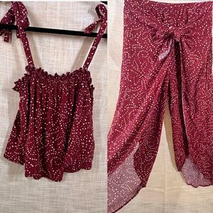 Matching set with red tank top and pant with side slits.